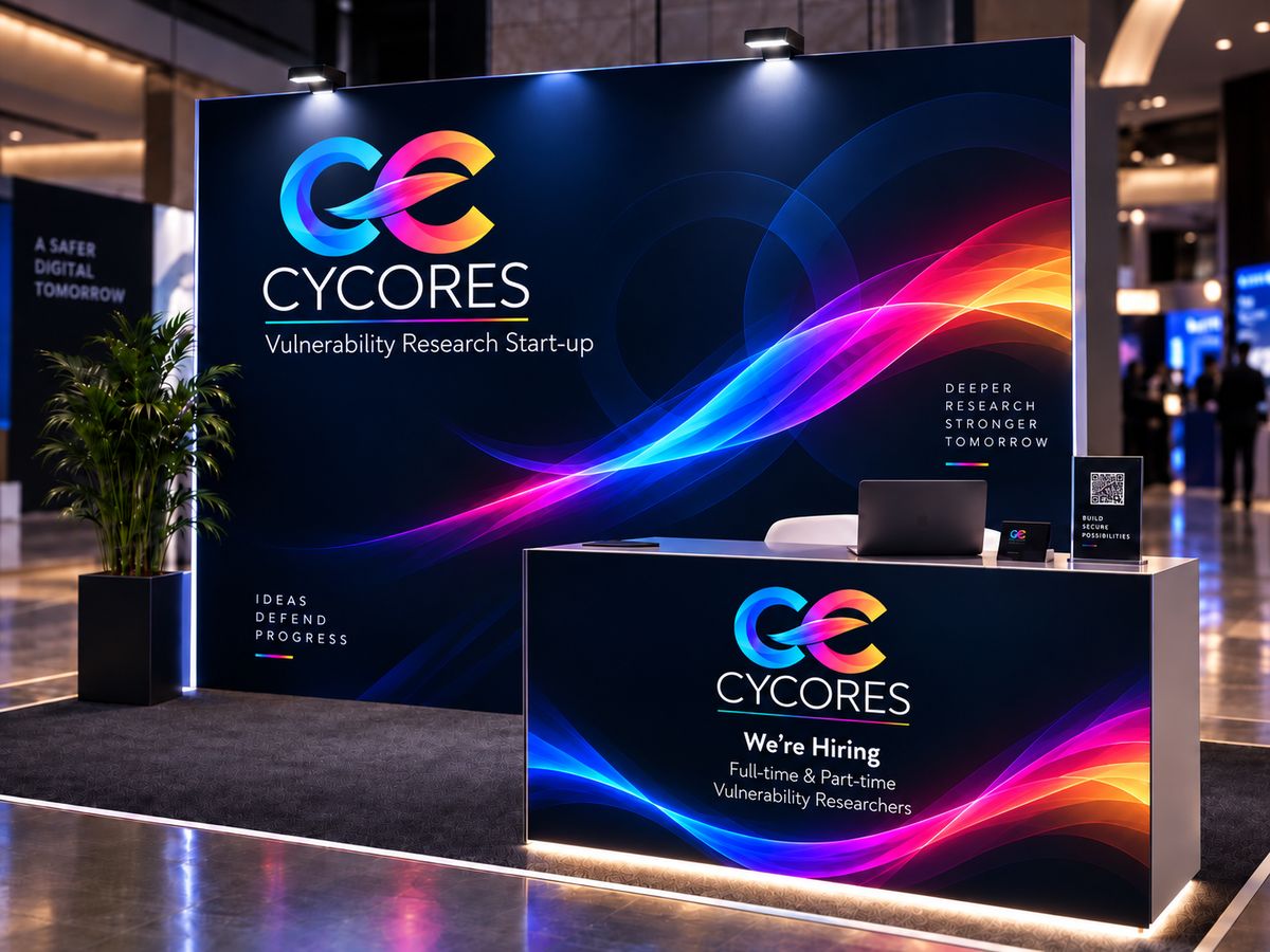 The Cycores conference booth, a dark navy wall with neon light waves and a desk reading We're Hiring.